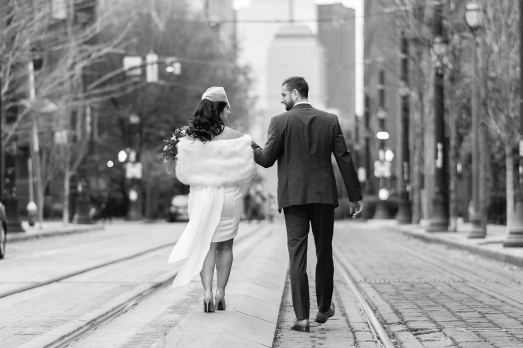 bride and groom walking holding hands
