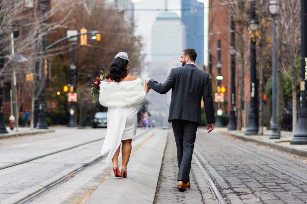 bride and groom walking holding hands